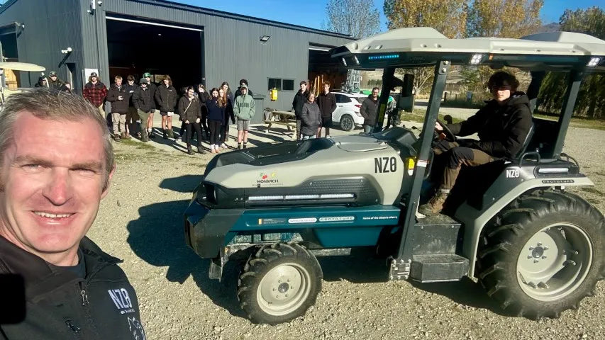 Visitor next to the electric tractor